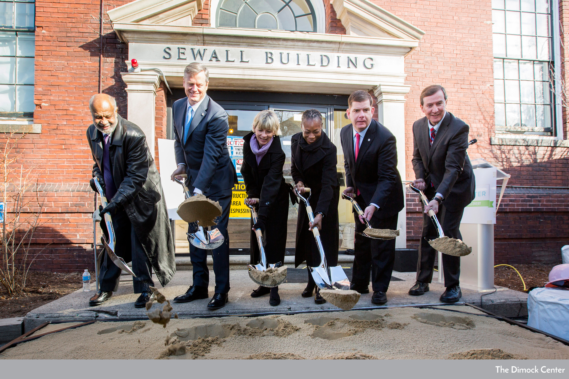Groundbreaking for a renovated brick building behind MA Gov. Baker and Boston Mayor Walsh at end of a fundraising campaign